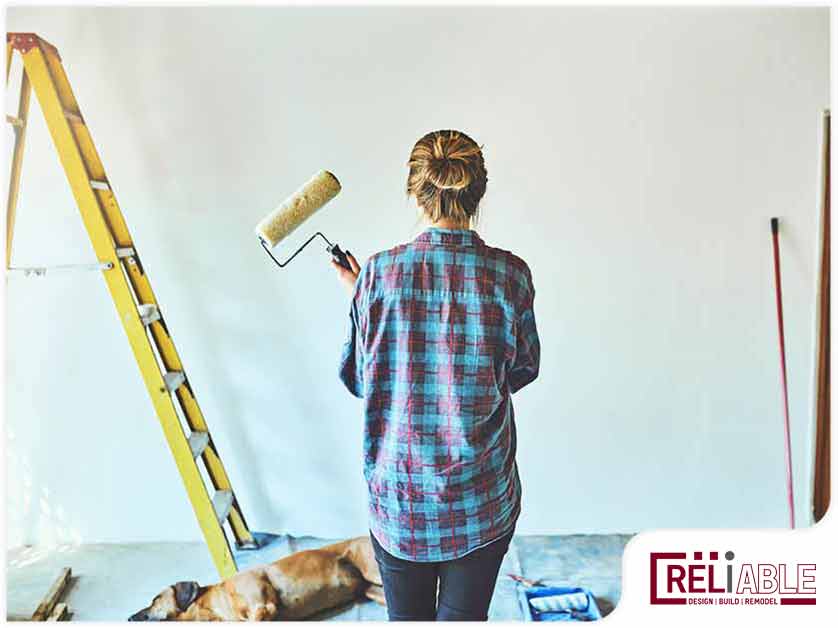 A Woman in a house painting project in Birmingham, AL