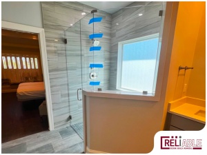Curbless Shower with door, with tape still visible on the glass