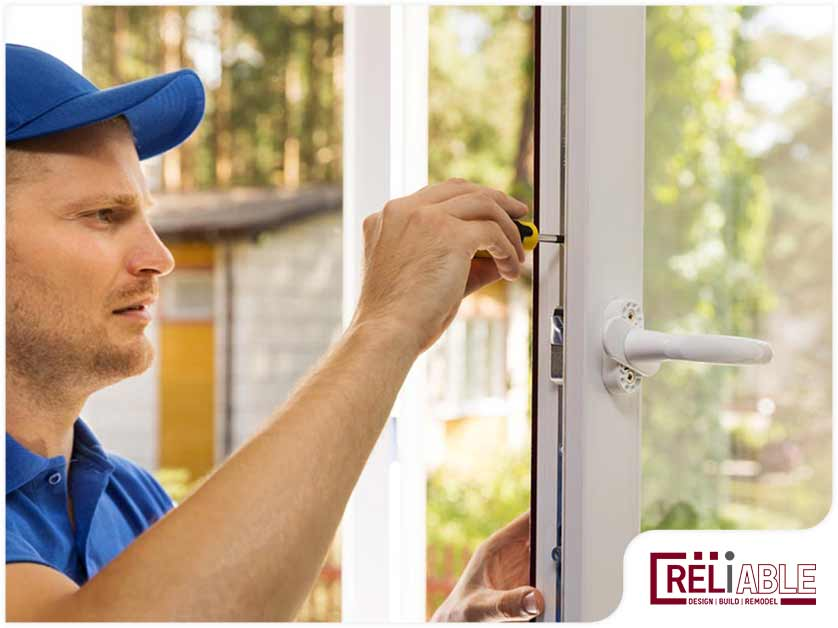 A repairman installing one of the best windows for home remodel projects